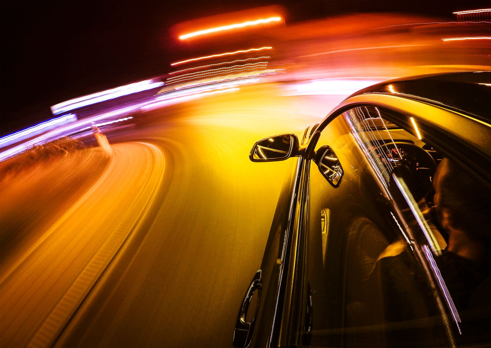 Dynamic car driving at night with light trails